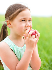 Image showing Portrait of a little girl with apple