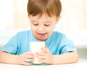 Image showing Cute little boy with a glass of milk