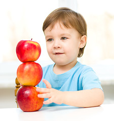 Image showing Portrait of a little boy with apples