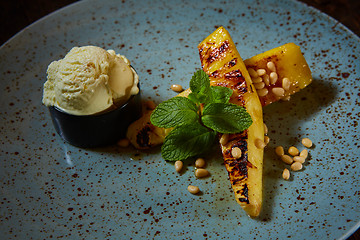 Image showing Grilled pineapple with vanilla ice cream