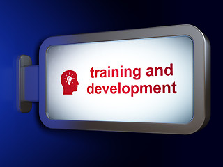 Image showing Learning concept: Training and Development and Head With Light Bulb on billboard background