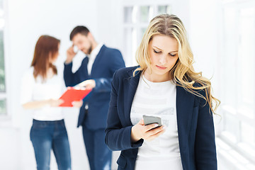 Image showing Portrait of businesswoman talking on phone in office