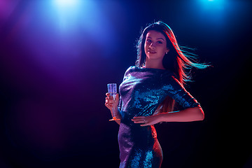 Image showing The beautiful girl dancing at the party drinking champagne