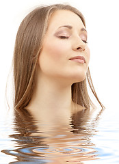 Image showing beautiful woman with closed eyes in water