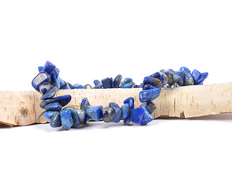 Image showing Splintered lapis lazuli chain on wood