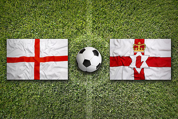 Image showing England vs. Northern Ireland flags on soccer field