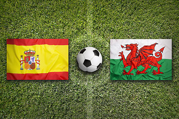 Image showing Spain vs. Wales flags on soccer field