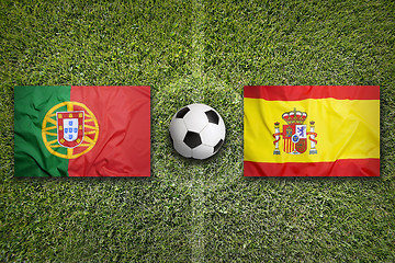 Image showing Portugal vs. Spain flags on soccer field