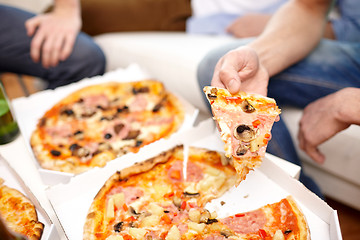 Image showing close up of friends with beer and pizza at home