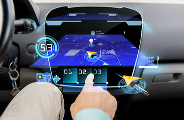 Image showing close up of man with gps navigator on car computer