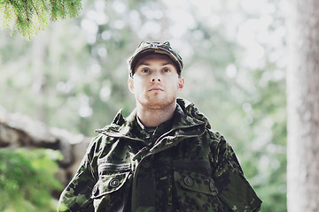 Image showing young soldier or ranger in forest