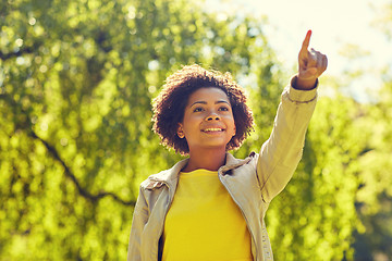 Image showing happy african american young woman in summer park