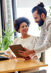 Image showing happy creative team with tablet pc in office