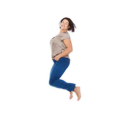 Image showing smiling happy plus size woman jumping high in air