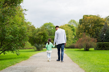 Image showing happy family walking in summer park