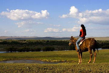 Image showing Asian Girl Horse Riding