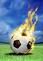 Image showing fiery soccer ball on grass