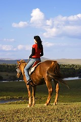 Image showing Asian Girl Horse Riding