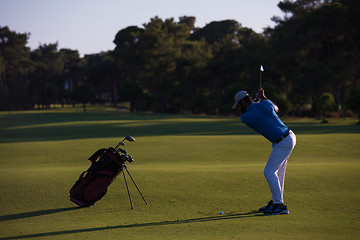 Image showing golfer hitting long shot