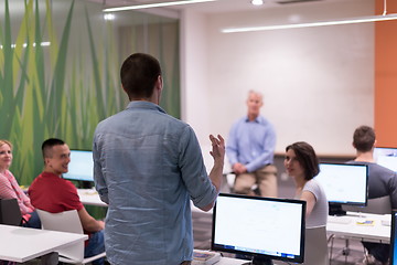 Image showing student answering a question in classroom