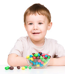 Image showing Portrait of a boy with candies