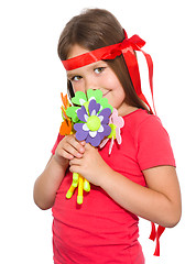 Image showing Cute little girl wit a bunch of flowers