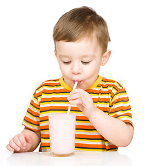 Image showing Cute little boy with a glass of milk