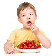 Image showing Little boy with strawberries