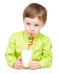 Image showing Cute little boy with a glass of milk