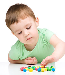 Image showing Portrait of a boy with candies