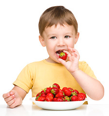 Image showing Little boy with strawberries