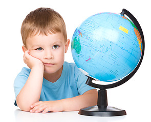 Image showing Little boy with a globe