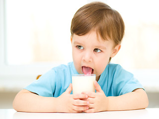 Image showing Cute little boy with a glass of milk