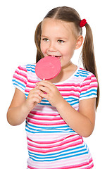 Image showing Little girl with lollipop