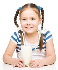 Image showing Cute little girl with a glass of milk