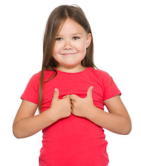 Image showing Little girl is showing thumb up gesture