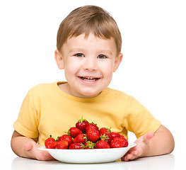 Image showing Little boy with strawberries