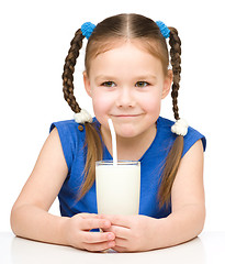 Image showing Cute little girl with a glass of milk