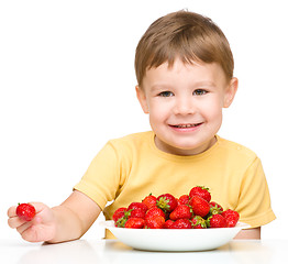 Image showing Little boy with strawberries