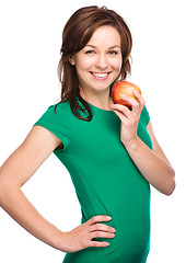 Image showing Young happy girl with apple