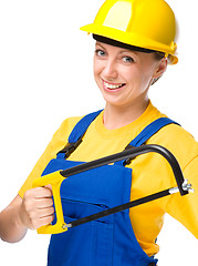 Image showing Young construction worker with hacksaw