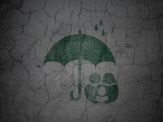 Image showing Safety concept: Family And Umbrella on grunge wall background