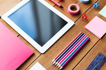 Image showing close up of school supplies and tablet pc