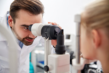 Image showing optician with tonometer and patient at eye clinic