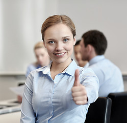 Image showing group of smiling businesspeople meeting in office