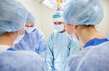 Image showing group of surgeons in operating room at hospital