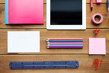 Image showing close up of school supplies and tablet pc