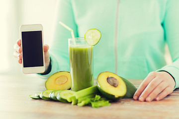 Image showing close up of woman with smartphone and vegetables