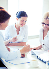 Image showing businesswoman with team on meeting in office