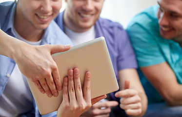 Image showing close up of happy friends with tablet pc at home